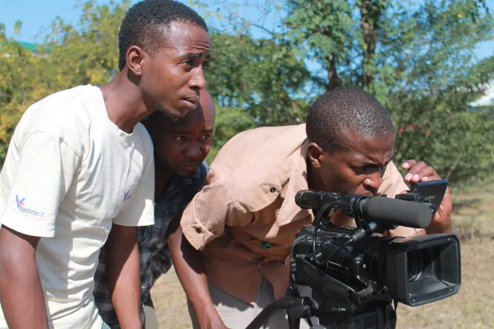 Film crew filming with a video camera